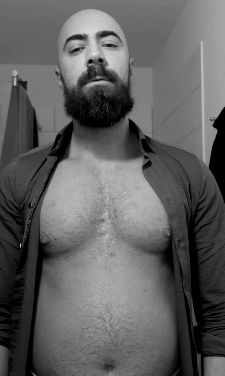 Augustine in 2019, about 94 kg: soft midsection, open shirt